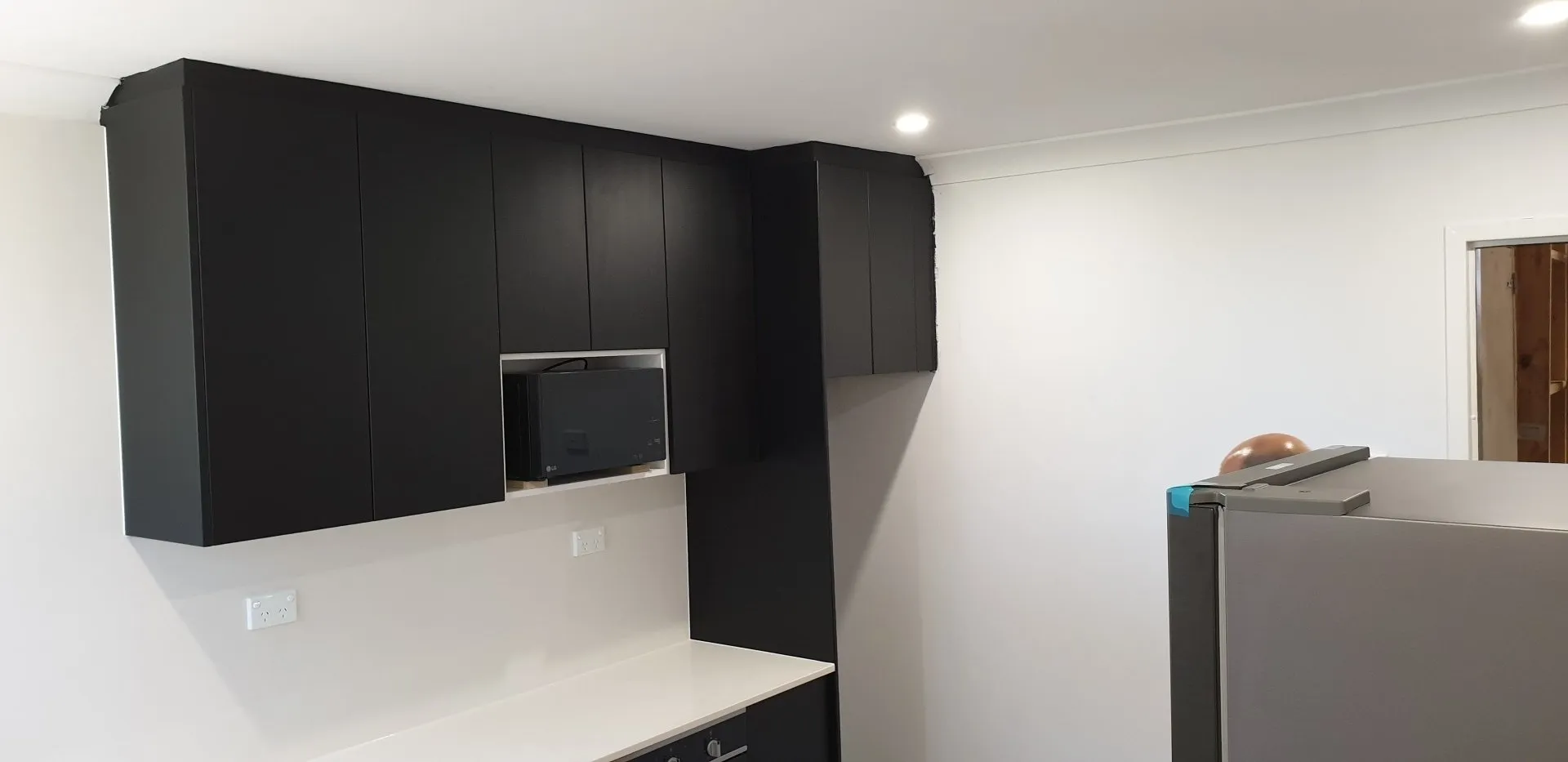 Kitchen With Sleek Black Cabinets